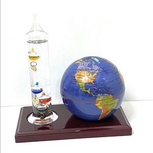 Galileo thermometer and globe on cherry wood stand